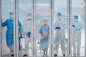 Dortor, Nurse and patient looking out in the quarantine room - 19 Concept