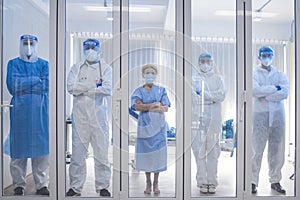 Dortor, Nurse and patient looking out in the quarantine room - Covid 19 Concept
