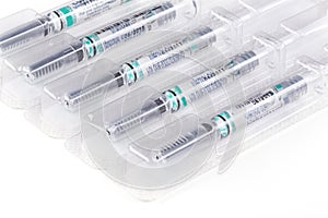 Doses of medication in sterile syringes photo