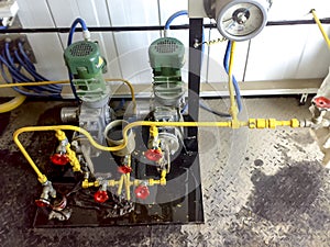 Dosing pumps in reagent block. Chemicals are fed into the system to better delaminate the oil and water emulsion.