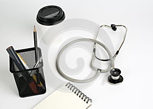 Dostor's working table,stethoscope on white photo