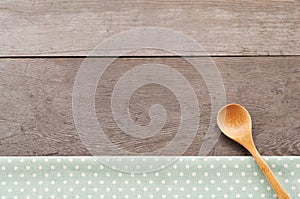Dot textile texture, wooden swooden spoons on wood textured background