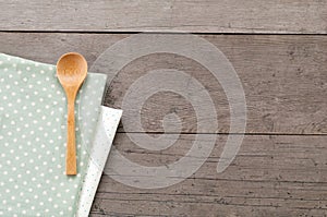 Dot textile texture, wooden swooden spoons on wood textured background