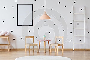 Dots wallpaper and wooden furniture