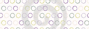 Dotty shibori tie dye sunburst circle border background. Seamless pattern on bleached resist white ribbon. Pastel dyed ink ring