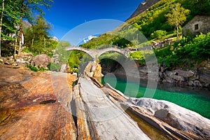 Double arch stone bridge at Ponte dei Salti with waterfall, Lavertezzo, Verzascatal, Ticino photo