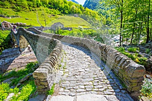 Double arch stone bridge at Ponte dei Salti with waterfall, Lavertezzo, Verzascatal, Ticino, Switzerland