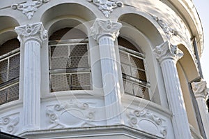 Double arched window on a brick facade of medieval wall. Biforium - ancient window with column, old architecture element.