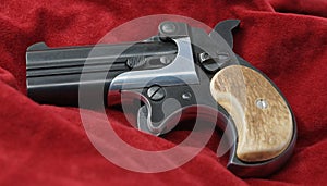 A double barrel derringer style pistol