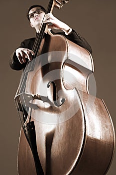 Double bass player with contrabass photo