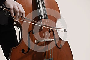 Double bass player contrabass bow