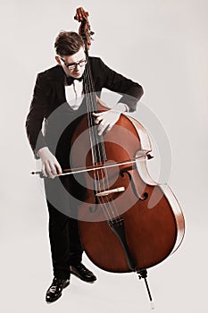 Double bass player playing contrabass photo