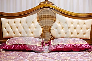 Double bed with decorative headboard