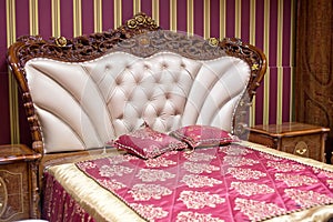 Double bed with decorative headboard