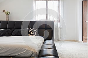 Double bed with elegant headrest