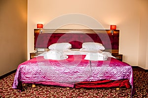 Double bed in luxury hotel room