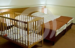 Double bed room with baby cot