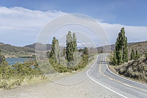 Double bend of road 83 at Benmore lake shore, New Zealand