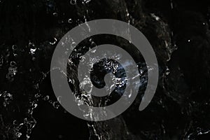 Double bokeh, beautiful sponges and ocean waves, splash water splashes into lines with a black background: used for website