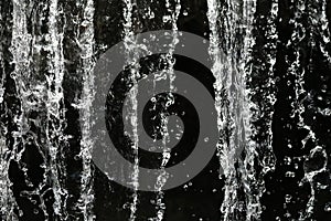 Double bokeh, beautiful sponges and ocean waves, splash water splashes into lines with a black background: used for website