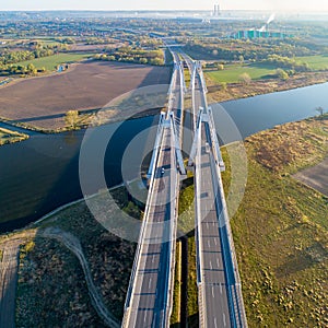 Double cable-stayed bridge in Krakow, Poland over the Vistula river at sunrise photo