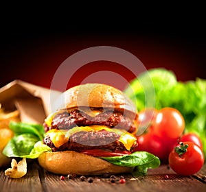 Double cheeseburger with fresh salad and french fries