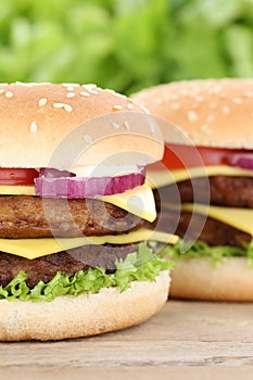Double cheeseburger hamburger closeup close up beef tomatoes let