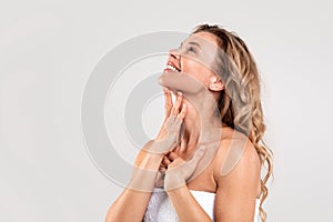 Double Chin Treatment. Beautiful Middle Aged Woman Touching Smooth Skin On Neck