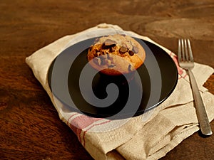 Double Chocolate Chip Muffin on plate and napkin