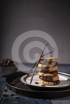 Double chocolate and vanilla cookies on a playful stack