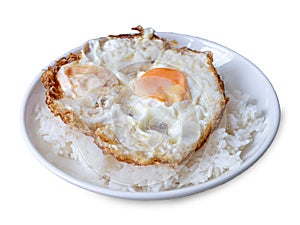 double crispy fried eggs on steam rice in white dish isolated on white background with clipping path