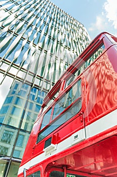 Double decker bus with modern building facade on background - Lo