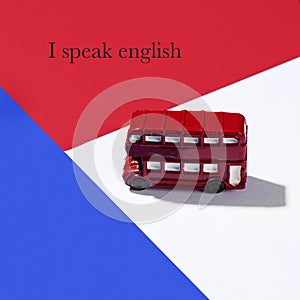 Double-decker bus and text I speak English