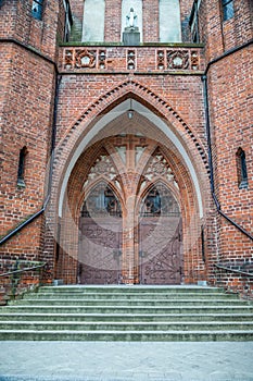 Double doors of the main entrance. Garrison Church in Olsztyn, Poland