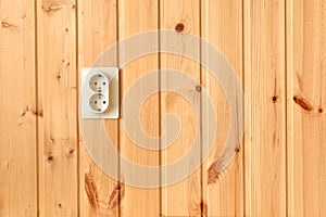 Double European socket AC 230V voltage on wooden plank wall