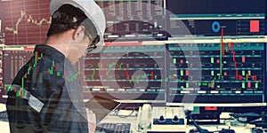 Double exposure of business man or engineer using tablet with stock trading room and stock trading chart background for investment