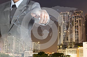 double exposure business man with finger world network and real estate background