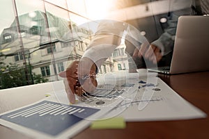 Double exposure of business man hand working