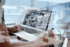 Double exposure of business man hand working on laptop