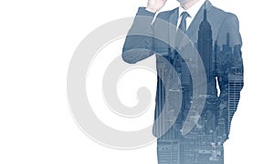 Double exposure of business man with mobile phone and city buildings background. abstract design idea