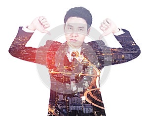 Double exposure of business man showing thumbs down gesture against city isolated on white background