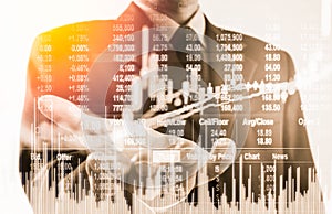 Double exposure business man on stock financial exchange. Stock