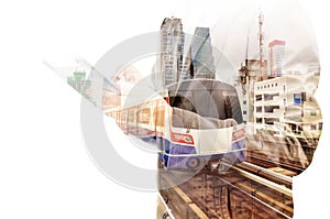 Double Exposure of Business Man use Tablet and Skytrain or Subway