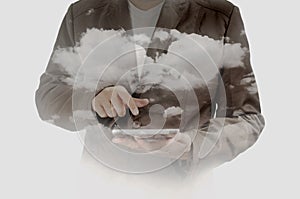 Double exposure of Business Man using Mobile Tablet PC with Clou