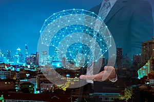 Double exposure of business man with welcome hand showing digital brain model and night modern city building background