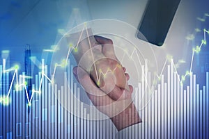 Businessmen handshake financial chart