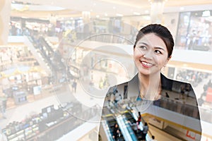 Double exposure of business woman thinking with department store