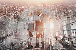 Double exposure-businessman and business woman stand to discuss and contact and deal of work about company projects,cityscape