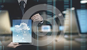 Double exposure of Businessman hand working with a Cloud Computing diagram on the new computer interface as concept