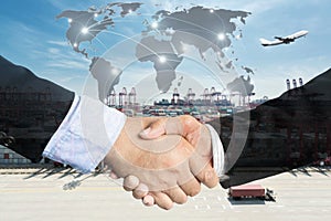 Double Exposure of a businessman handshake with Map global part